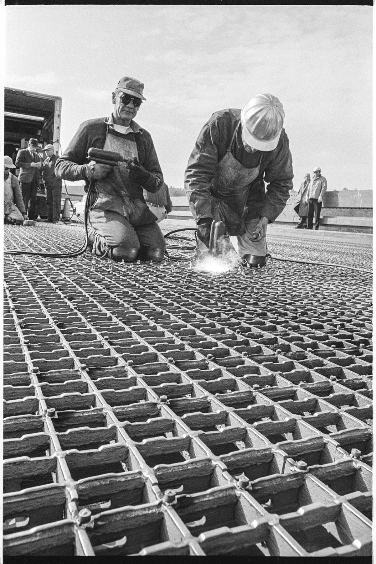 Image of Ironworkers skidproofing 1st Avenue S. bridge, Seattle, March 23, 1964